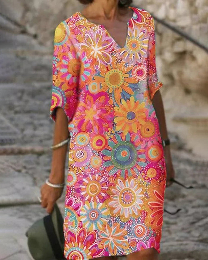 Robe à col en V à manches courtes et à motifs floraux de couleurs vives - Bonita