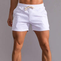 Short décontracté pour hommes avec taille élastique, tissu en coton respirant, coupe ajustable et poches latérales pratiques