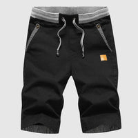 Shorts décontractés pour hommes avec cordon à la taille, poches zippées et coupe ample jusqu'au genou