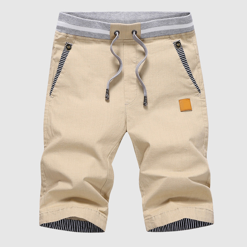 Shorts décontractés pour hommes avec cordon à la taille, poches zippées et coupe ample jusqu'au genou