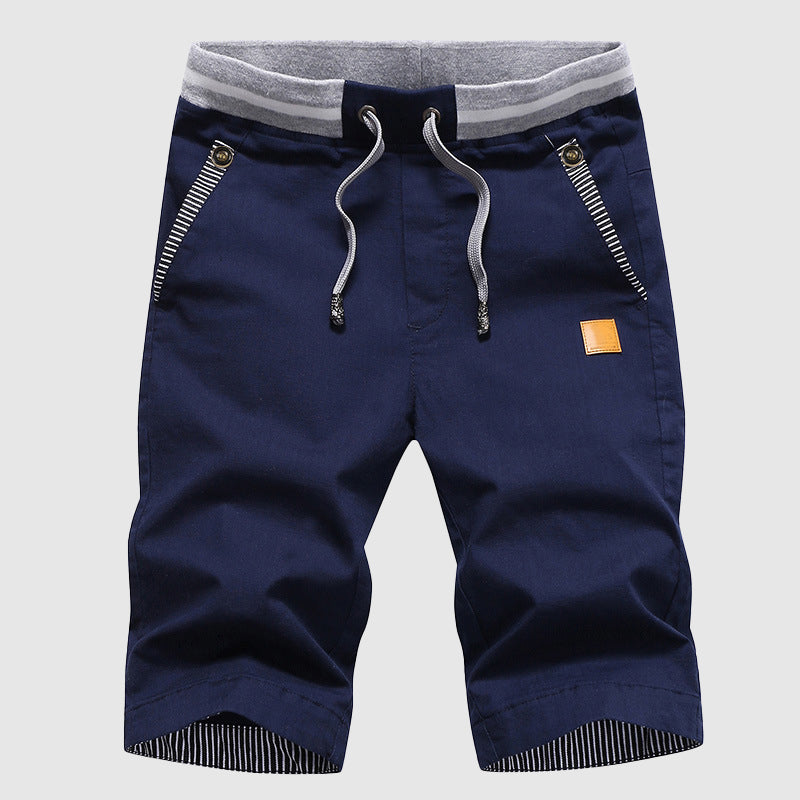 Shorts décontractés pour hommes avec cordon à la taille, poches zippées et coupe ample jusqu'au genou