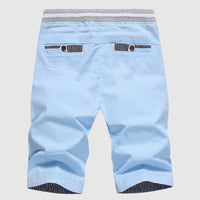 Shorts décontractés pour hommes avec cordon à la taille, poches zippées et coupe ample jusqu'au genou