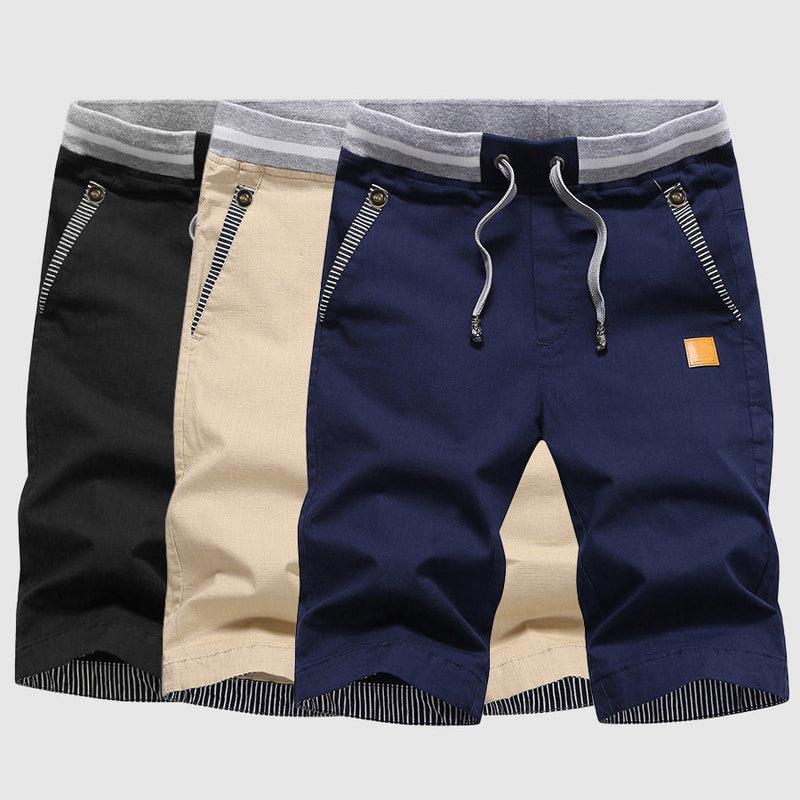 Shorts décontractés pour hommes avec cordon à la taille, poches zippées et coupe ample jusqu'au genou