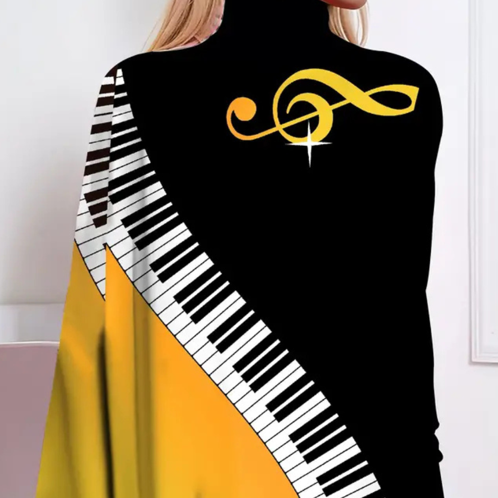 Élégant chemisier cape pour femmes - élégant haut noir et jaune avec un magnifique motif de piano