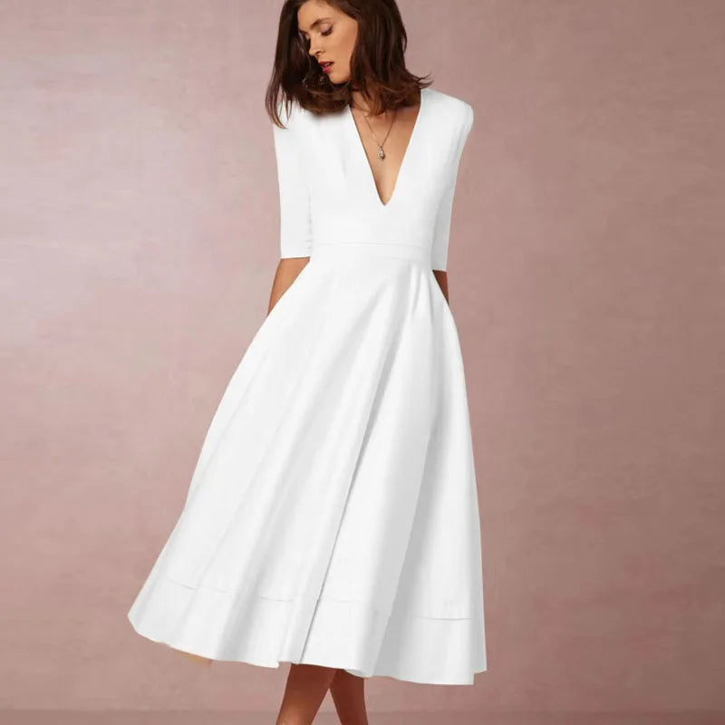 Robe midi élégante avec décolleté en V et jupe volumineuse pour un look élégant.