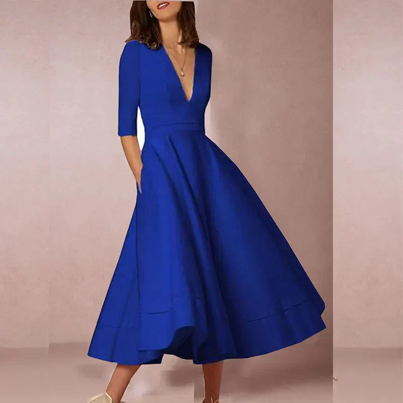 Robe midi élégante avec décolleté en V et jupe volumineuse pour un look élégant.