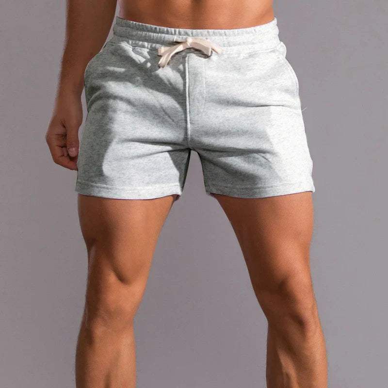 Short décontracté pour hommes avec taille élastique, tissu en coton respirant, coupe ajustable et poches latérales pratiques
