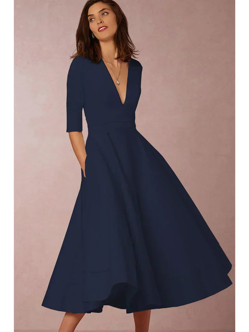Robe midi élégante avec décolleté en V et jupe volumineuse pour un look élégant.