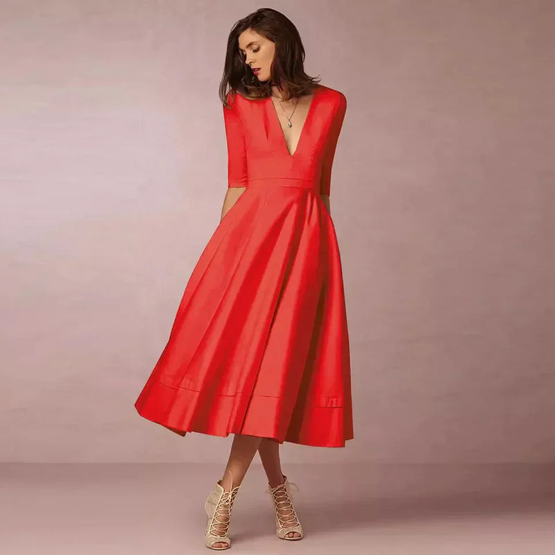 Robe midi élégante avec décolleté en V et jupe volumineuse pour un look élégant.
