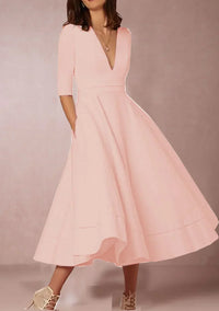 Robe midi élégante avec décolleté en V et jupe volumineuse pour un look élégant.