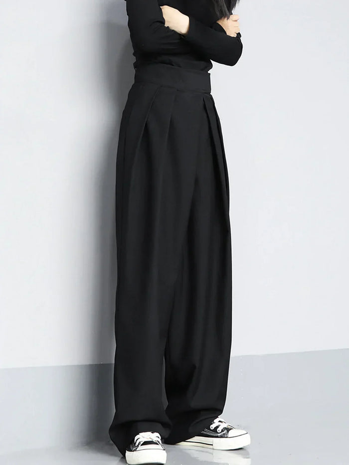 Pantalon noir polyvalent à jambes larges pour femmes, avec des plis élégants pour un look chic et décontracté