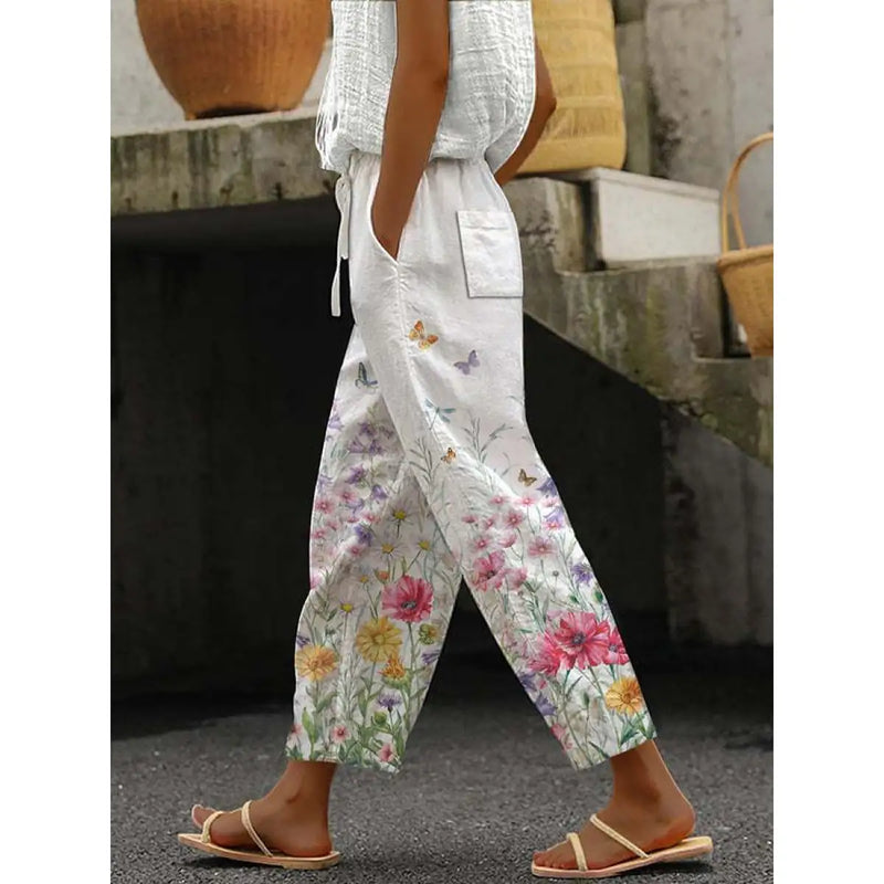 Élégant pantalon décontracté pour femmes avec un imprimé floral accrocheur - un vêtement d'intérieur confortable et aéré pour tous les jours