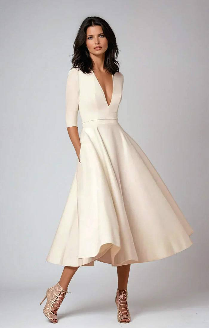 Robe midi élégante avec décolleté en V et jupe volumineuse pour un look élégant.