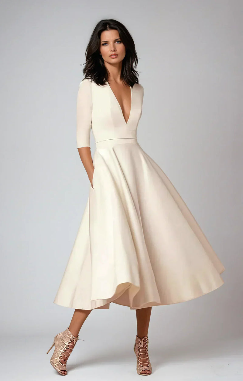 Robe midi élégante avec décolleté en V et jupe volumineuse pour un look élégant.