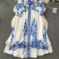 Robe chemise midi élégante à ceinture imprimée, parfaite pour un style chic et décontracté en toute saison