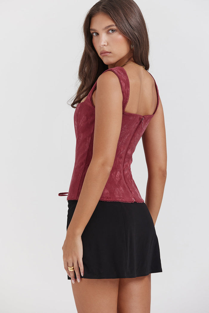 Élégant top corset à lacets pour femme, de couleur merlot, pour un look sophistiqué.